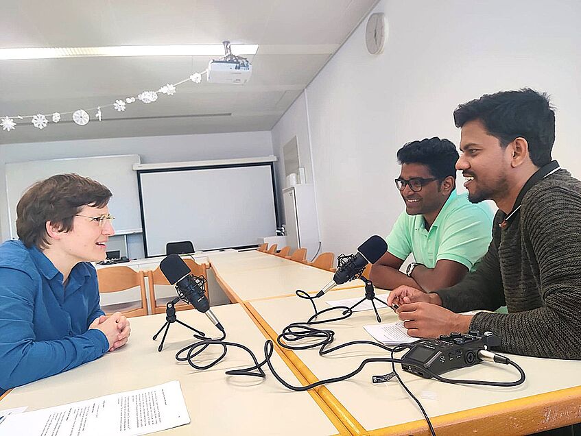 Photo of Marietta, Hari and Ranjith recording the podcast.