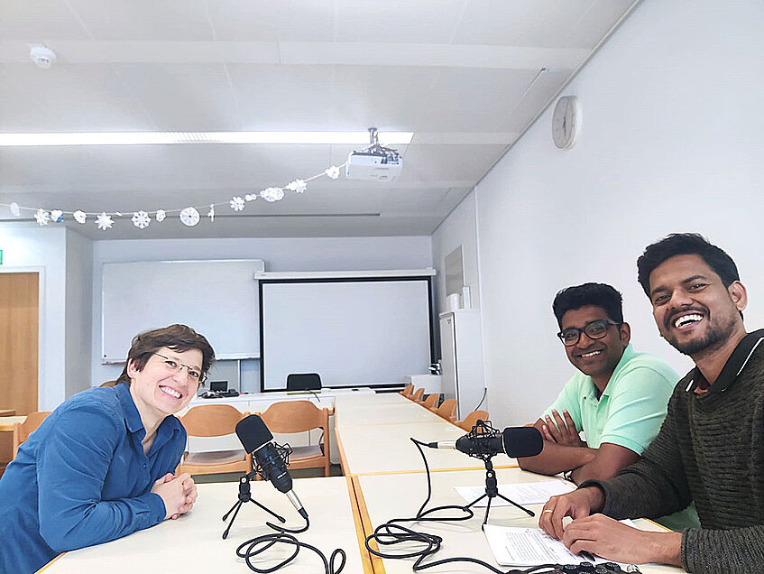 Photo of Marietta, Hari and Ranjith recording the podcast.